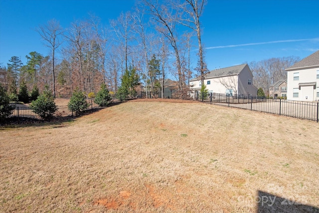 view of yard featuring a residential view and fence