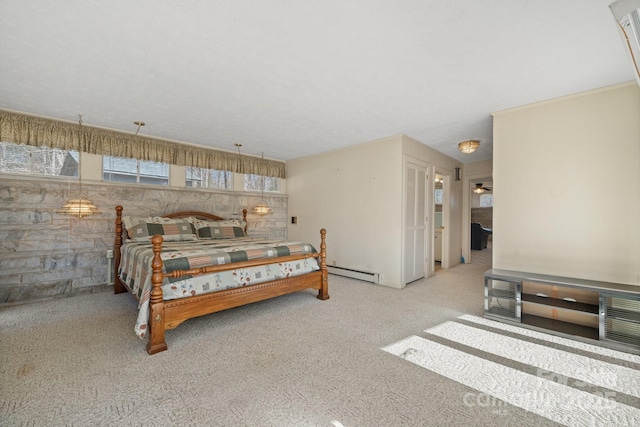 bedroom with a baseboard radiator and light colored carpet