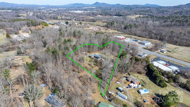 drone / aerial view featuring a mountain view