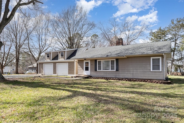 view of front of house featuring roof with shingles, a chimney, and a front yard