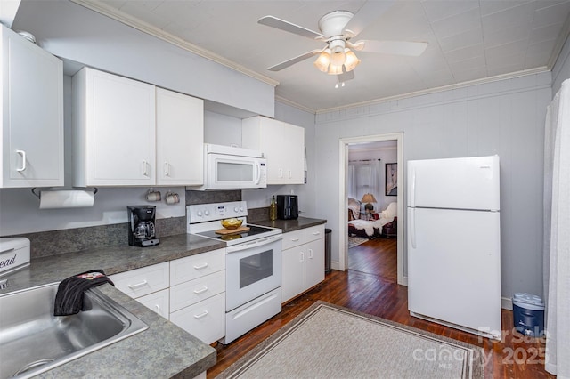 kitchen featuring white appliances, dark wood-type flooring, a sink, white cabinetry, and ornamental molding