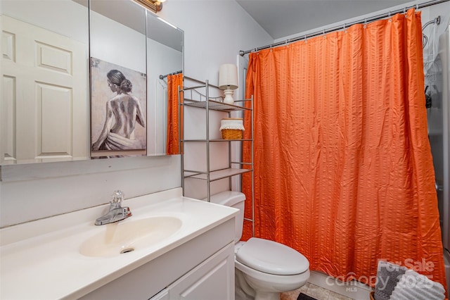 bathroom with vanity, toilet, and a shower with curtain