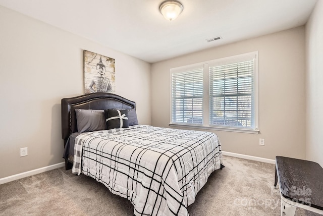 bedroom featuring carpet, visible vents, and baseboards