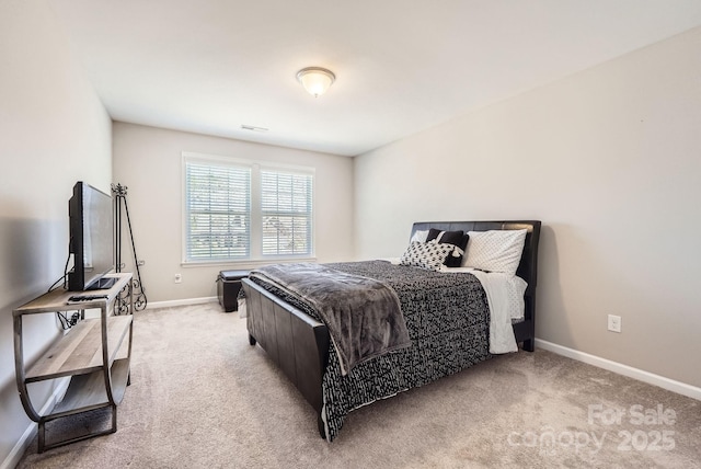 bedroom featuring visible vents, baseboards, and light colored carpet