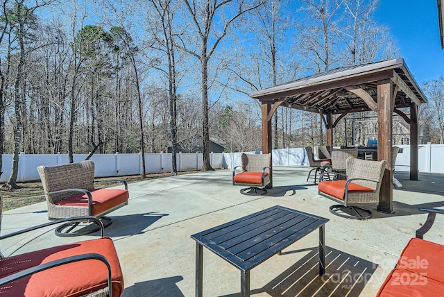 view of patio / terrace with a fenced backyard and a gazebo