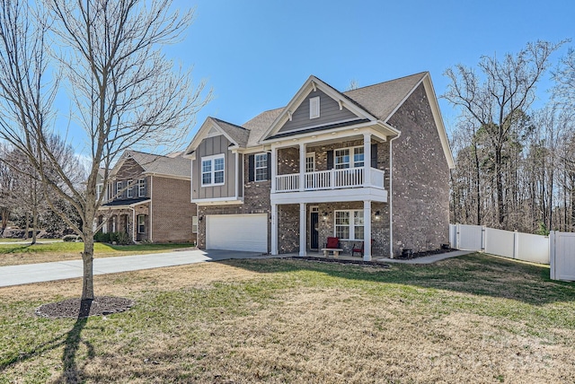 view of front of property featuring driveway, board and batten siding, a front yard, and fence