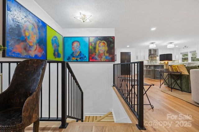 stairway with wood finished floors