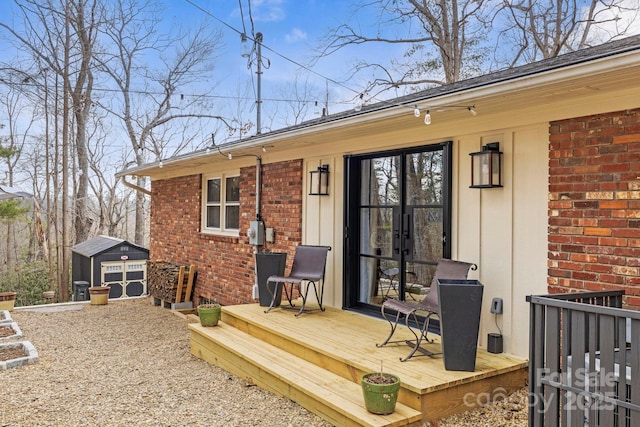 deck with a storage unit and an outdoor structure