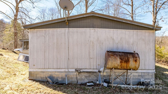 view of property exterior featuring an outdoor structure