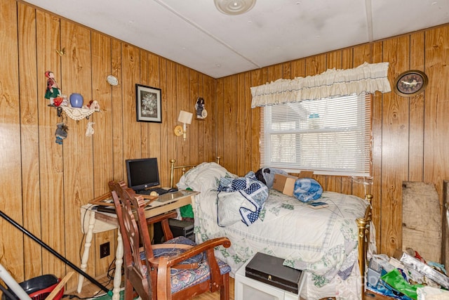 bedroom with wood walls