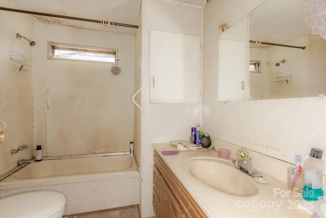 full bath featuring bathtub / shower combination, vanity, and toilet