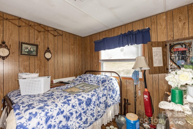 bedroom featuring wood walls