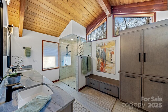 full bath with a sink, beamed ceiling, a stall shower, and wooden ceiling