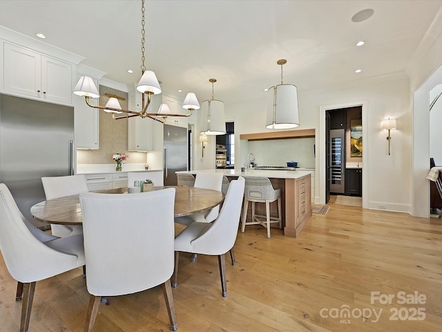 dining space featuring light wood-style floors and recessed lighting