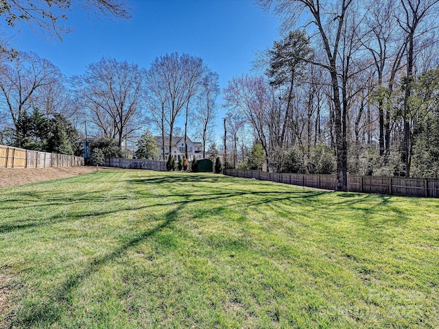 view of yard with a fenced backyard