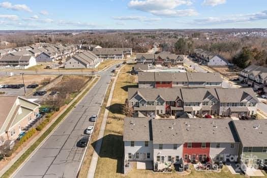 birds eye view of property with a residential view