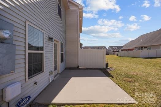 view of patio / terrace featuring fence