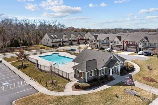 view of pool featuring fence, a residential view, and a fenced in pool