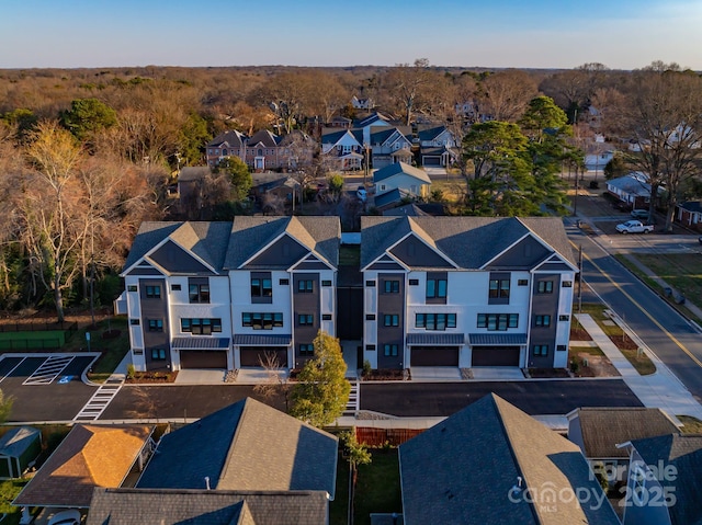 birds eye view of property with a residential view