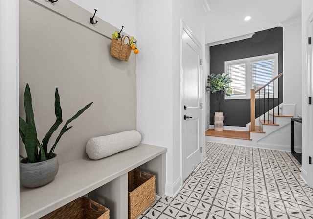 mudroom with recessed lighting and baseboards