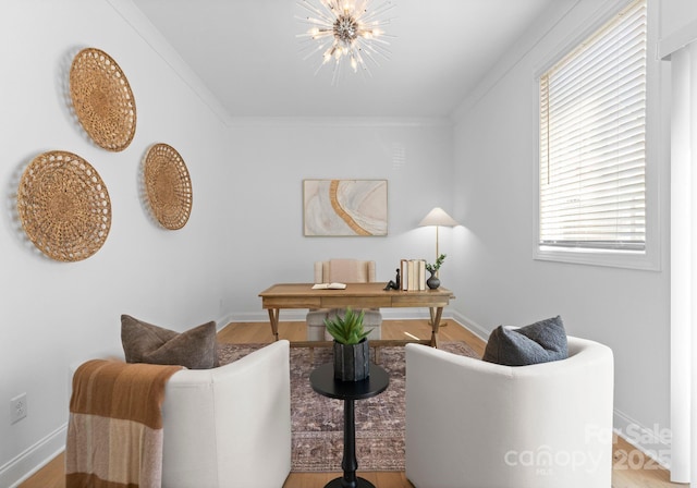 office featuring crown molding, baseboards, and an inviting chandelier