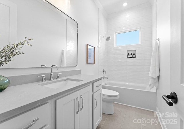 full bath featuring toilet, shower / bath combination, vanity, and tile patterned floors