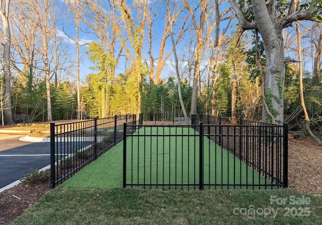 view of gate featuring fence