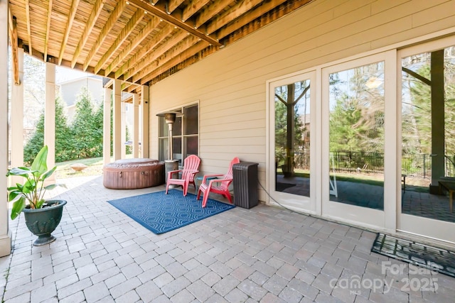 view of patio with a hot tub