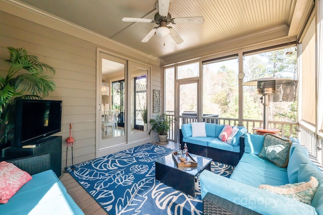 sunroom featuring plenty of natural light and ceiling fan