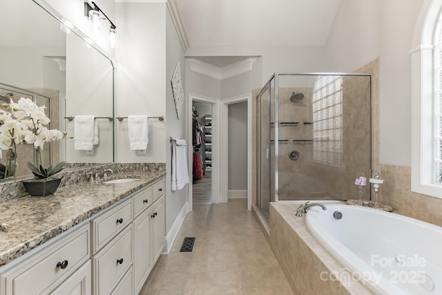 full bathroom featuring visible vents, a garden tub, a shower stall, and a spacious closet