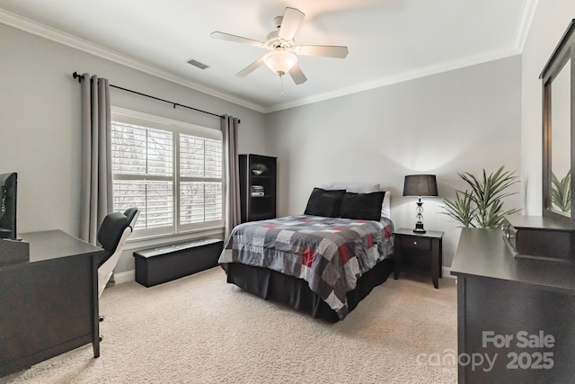 bedroom featuring ceiling fan, visible vents, crown molding, and light colored carpet