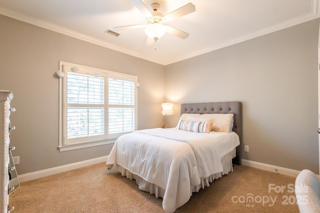 bedroom featuring light carpet, baseboards, visible vents, and crown molding