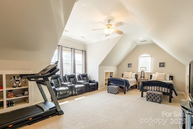 carpeted bedroom featuring ceiling fan, multiple windows, and vaulted ceiling