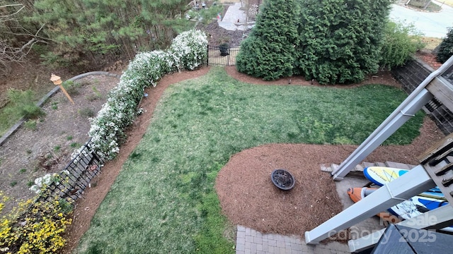 view of yard with a garden and fence
