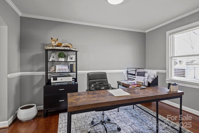 office space with crown molding, baseboards, dark wood-style flooring, and arched walkways