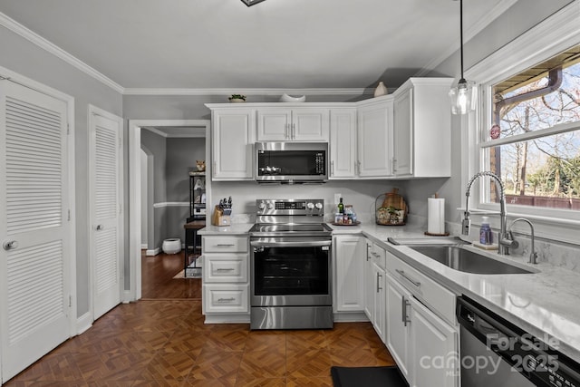 kitchen with a sink, light countertops, white cabinetry, and stainless steel appliances