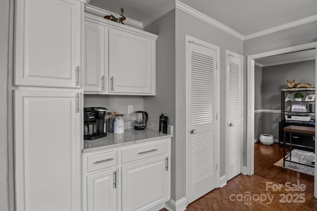 bar with crown molding and baseboards