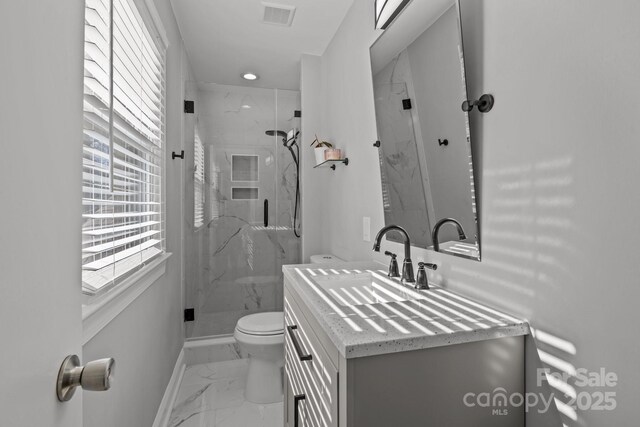 bathroom with vanity, visible vents, a marble finish shower, toilet, and marble finish floor