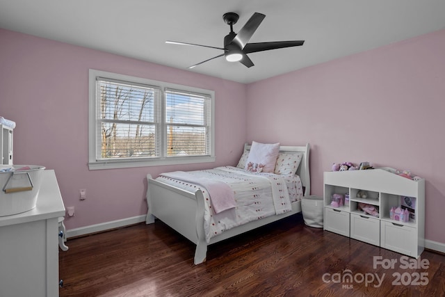 bedroom with ceiling fan, baseboards, and wood finished floors