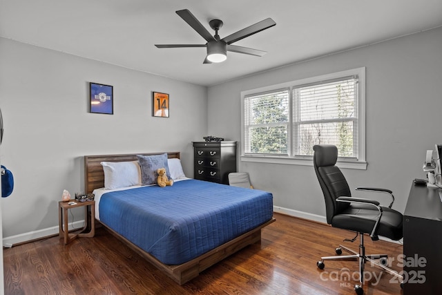 bedroom featuring wood finished floors, baseboards, and ceiling fan