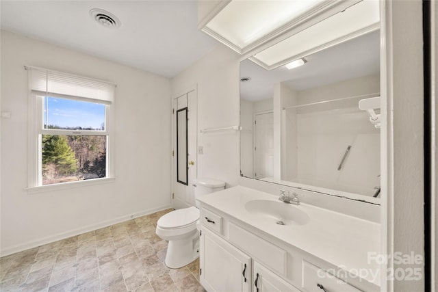 full bath with baseboards, visible vents, toilet, walk in shower, and vanity