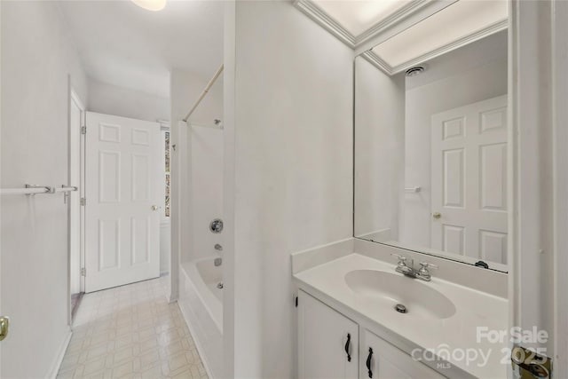 bathroom featuring bathtub / shower combination, vanity, and tile patterned floors