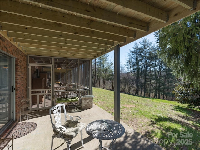 view of patio / terrace with a sunroom