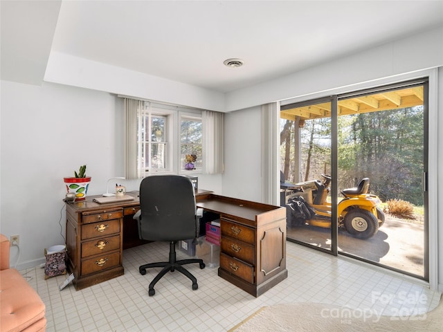 office area featuring visible vents and a healthy amount of sunlight