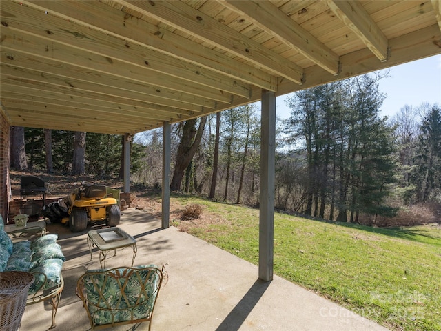 view of patio / terrace with a view of trees