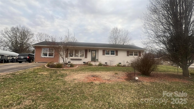 ranch-style house featuring driveway, a front lawn, and crawl space