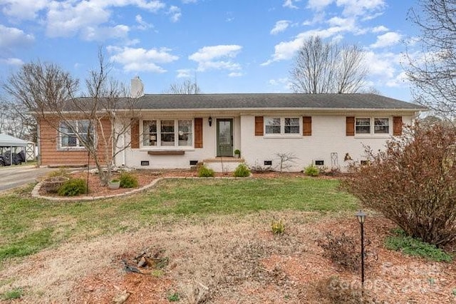 single story home featuring crawl space, aphalt driveway, and a front yard