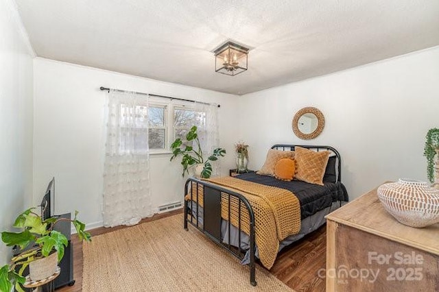 bedroom featuring wood finished floors