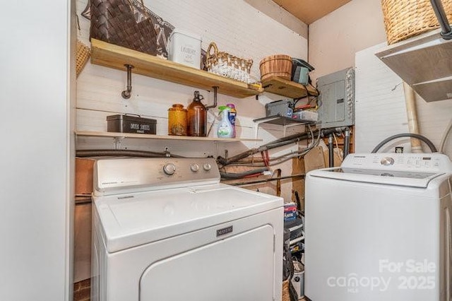 laundry area with laundry area, electric panel, and independent washer and dryer