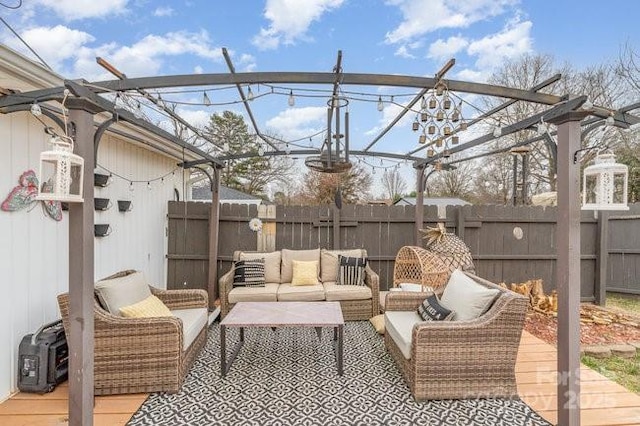 view of patio / terrace with outdoor lounge area and fence